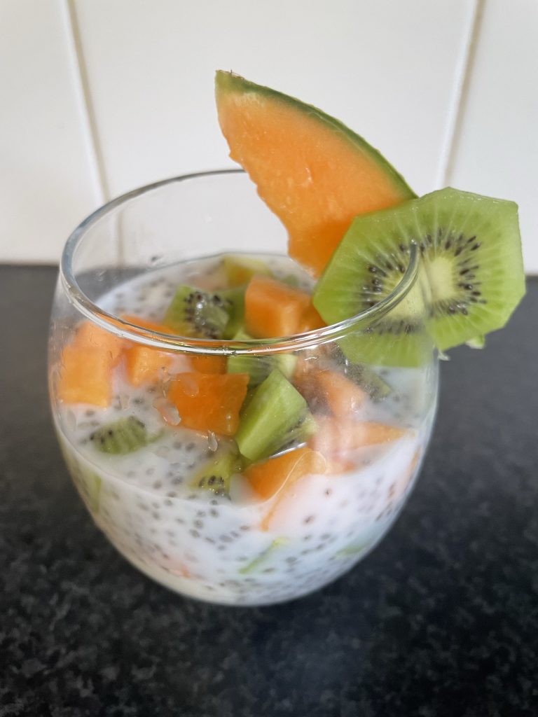 Tropical Chia Seed Pudding Pot with kiwi and melon.